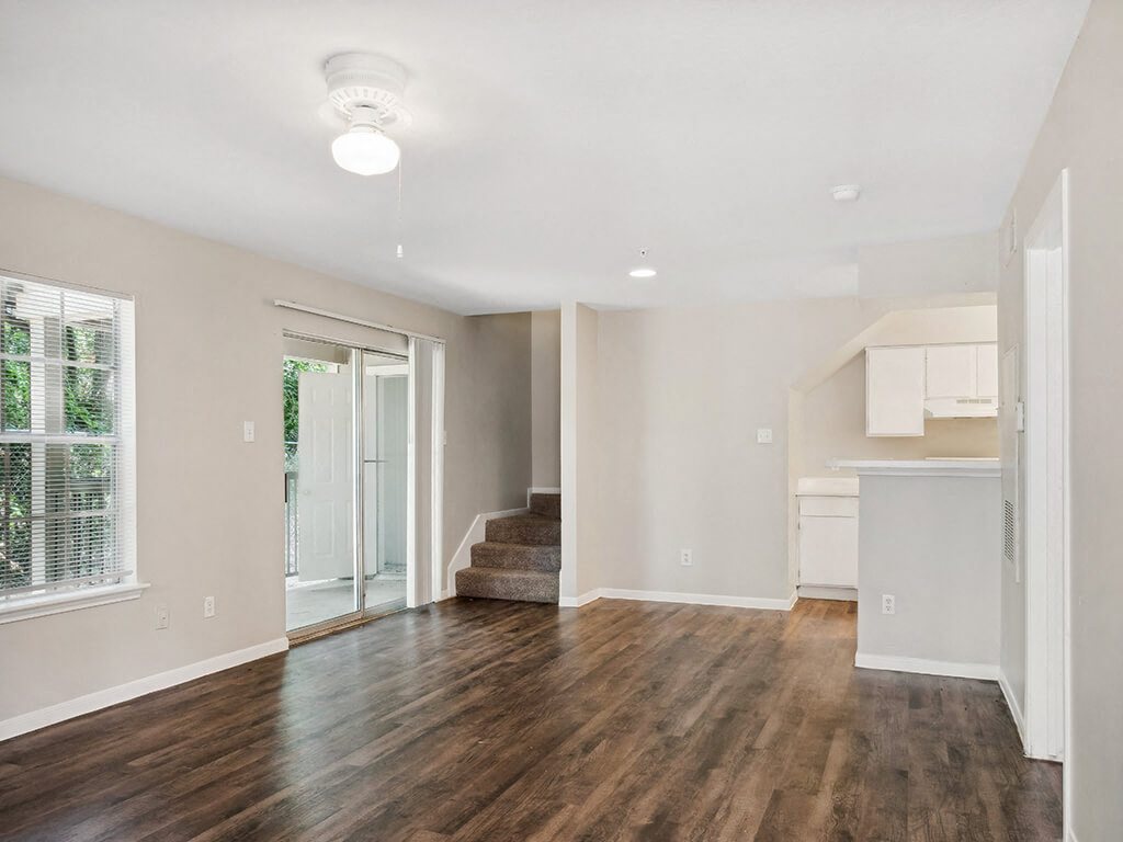 Living room with overhead lighting at Park Village Apartments in Conroe TX